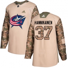 Men's Adidas Columbus Blue Jackets #37 Markus Hannikainen Authentic Camo Veterans Day Practice NHL Jersey