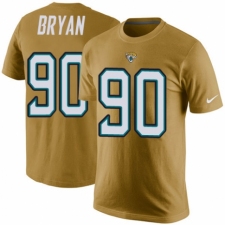 NFL Men's Nike Jacksonville Jaguars #90 Taven Bryan Gold Rush Pride Name & Number T-Shirt